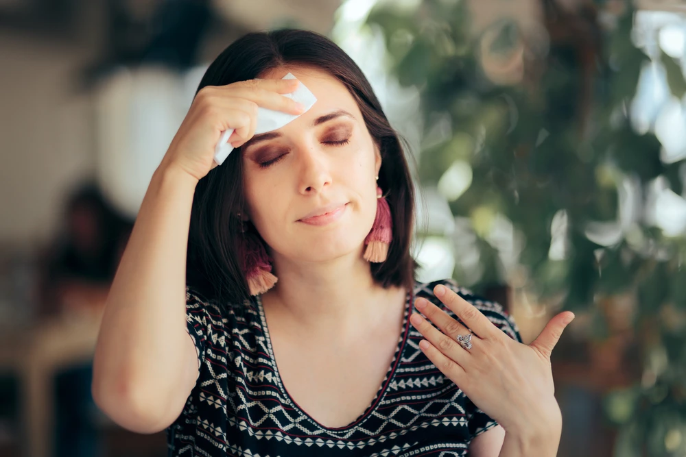 Woman suffering with a hot flash